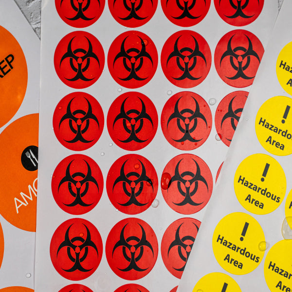 Waterproof Hazard round labels by Go2Products