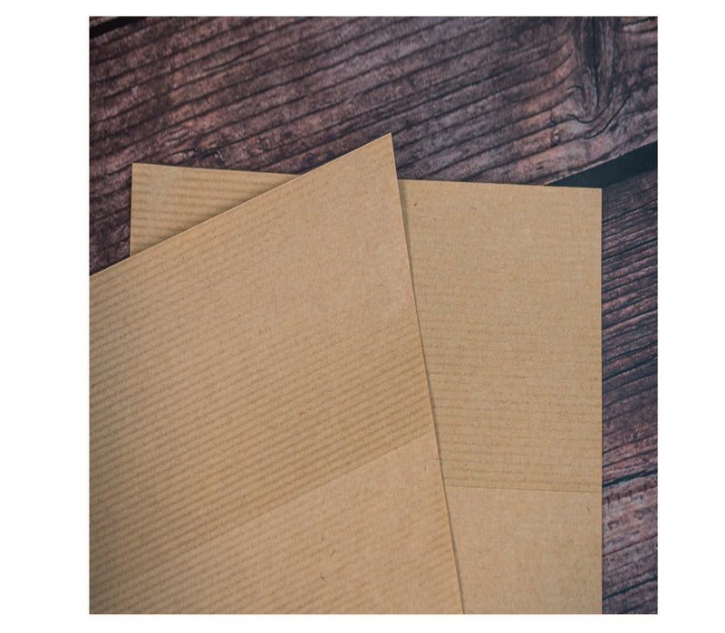 Close up image of our pin stripe brown kraft labels on sheets with a permanent adhesive. 