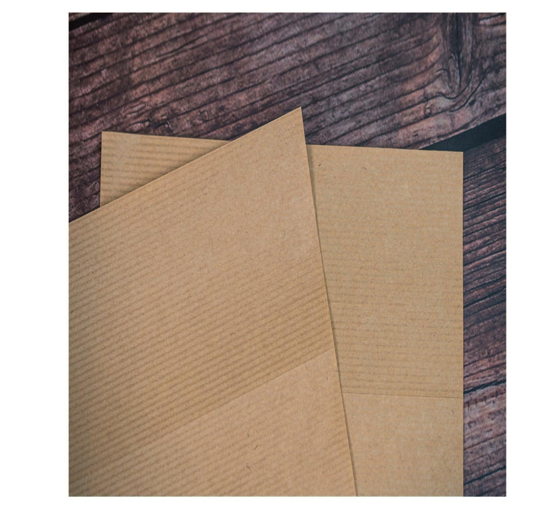 Close up image of our pin stripe brown kraft labels on sheets with a permanent adhesive. 
