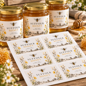 Custom printed honey labels on sheets shown on Suffolk Honey jars