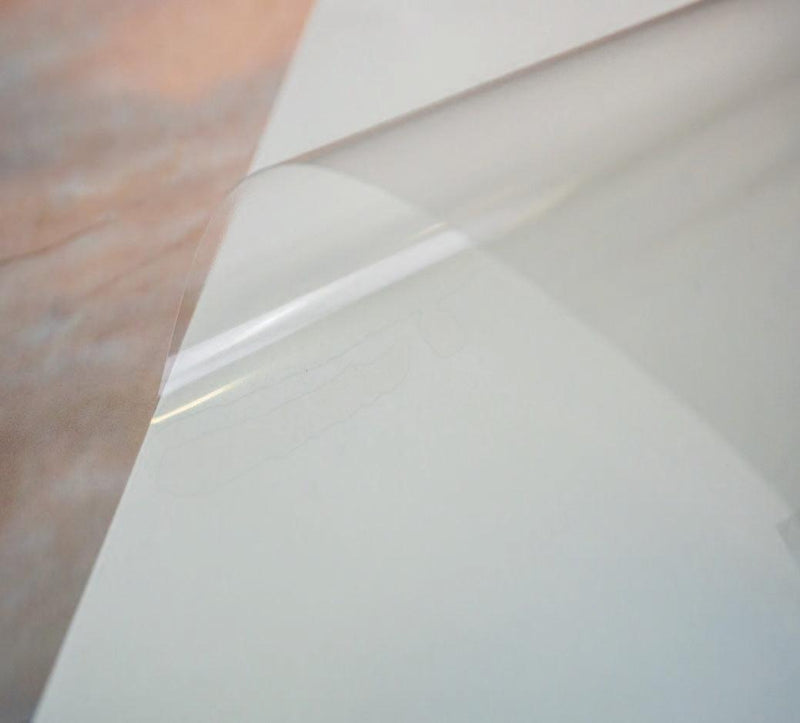 Close up image of our transparent gloss laser printable with a permanent adhesive